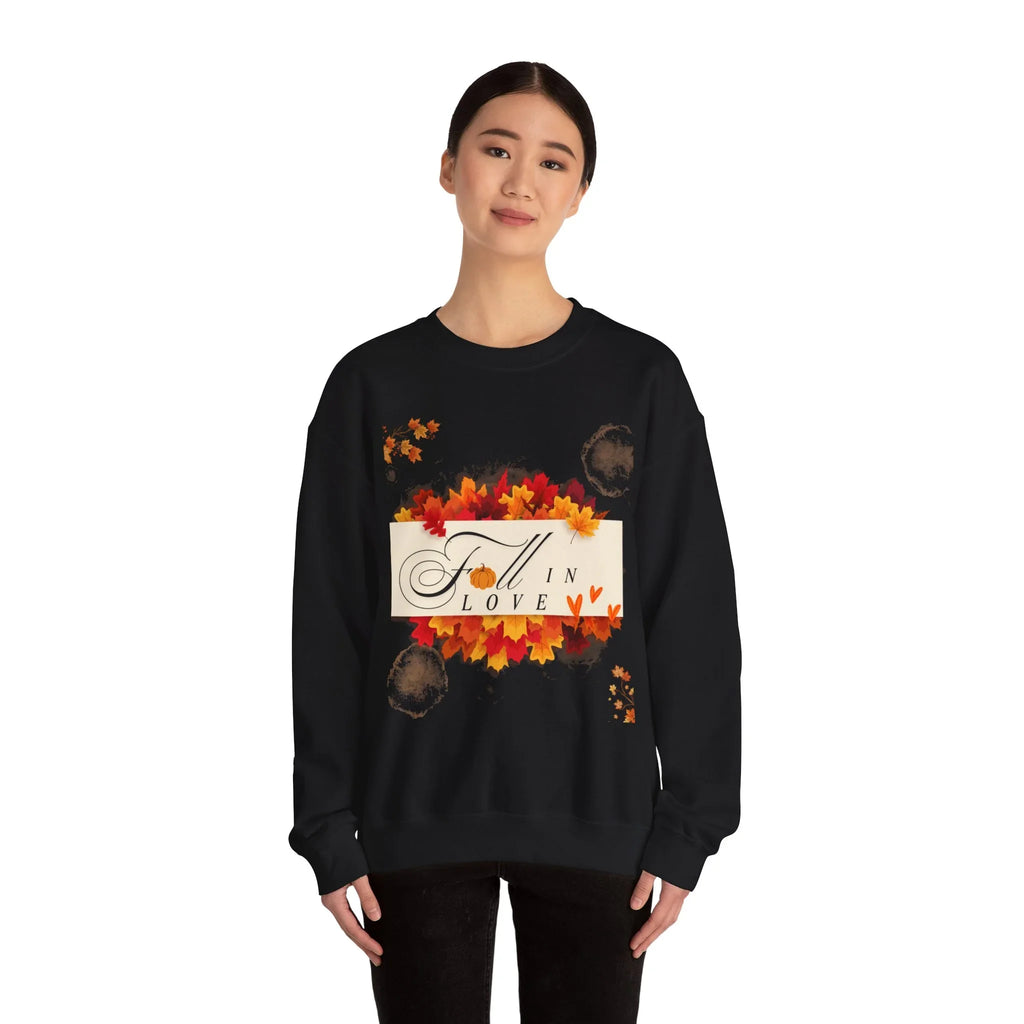 Woman wearing black fall-themed sweatshirt with 'Fall in Love' text and autumn leaves