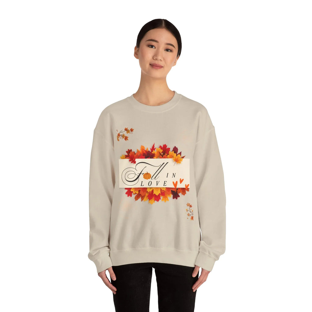 Woman wearing beige Fall in Love sweatshirt with autumn leaves design on white background