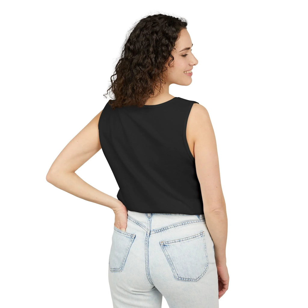 Woman in black sleeveless top and light wash jeans, shown from the back, on white background
