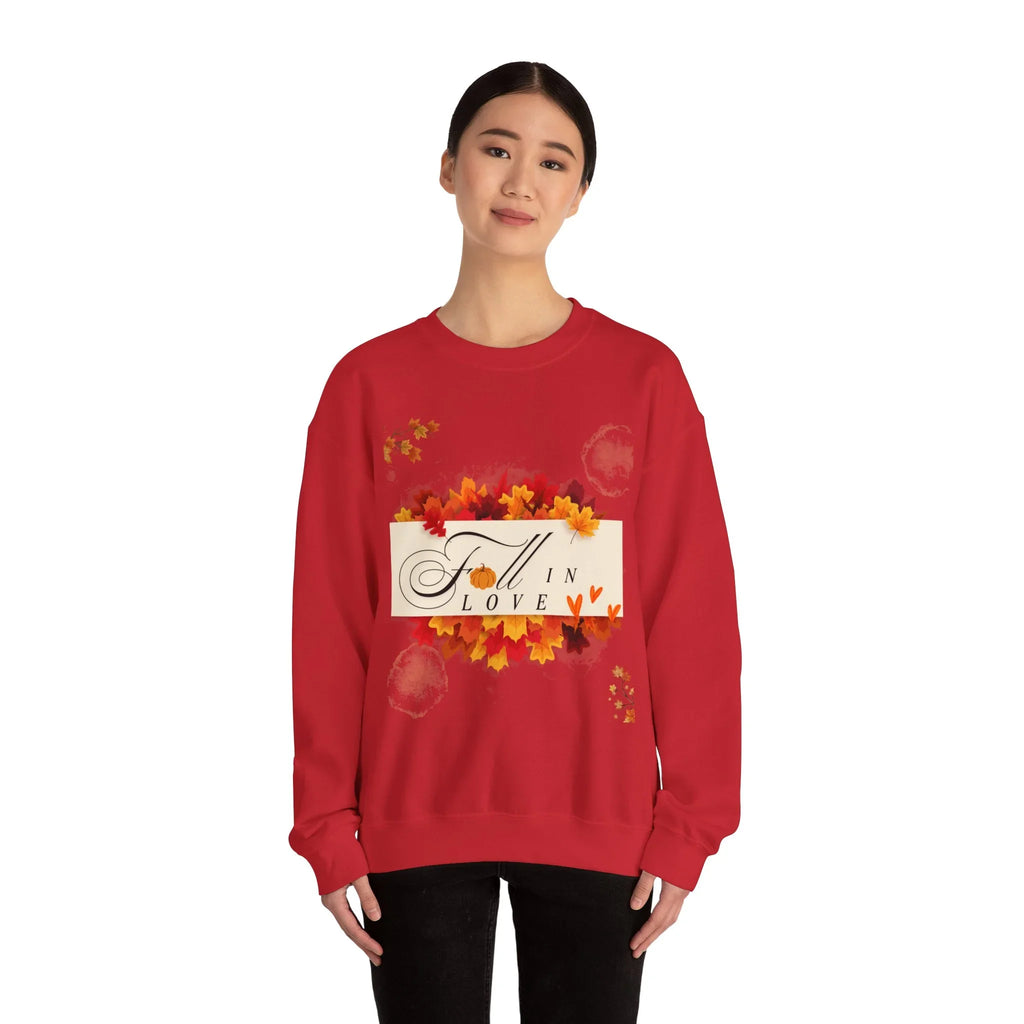 Woman wearing red sweatshirt with fall leaves and 'Fall in Love' design on front