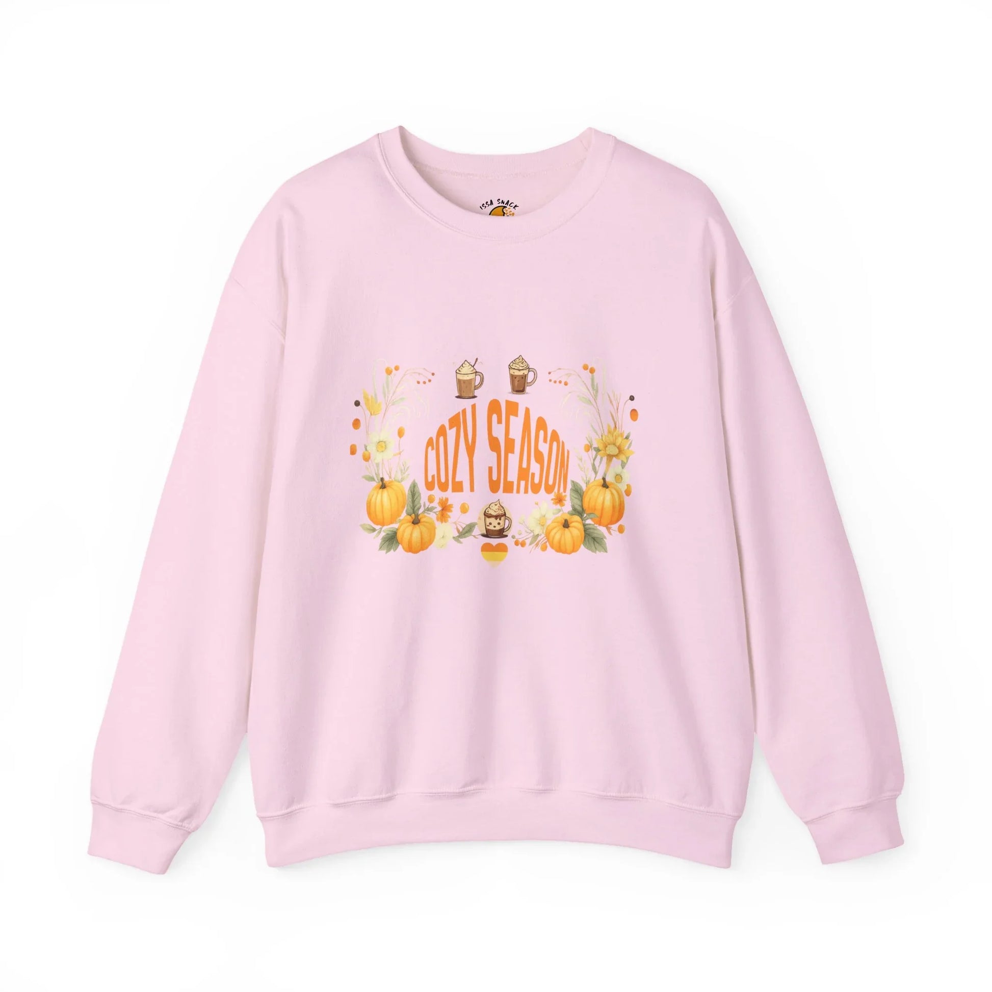 Pink sweatshirt with 'Cozy Season' text, pumpkins, sunflowers, and fall drinks graphic.