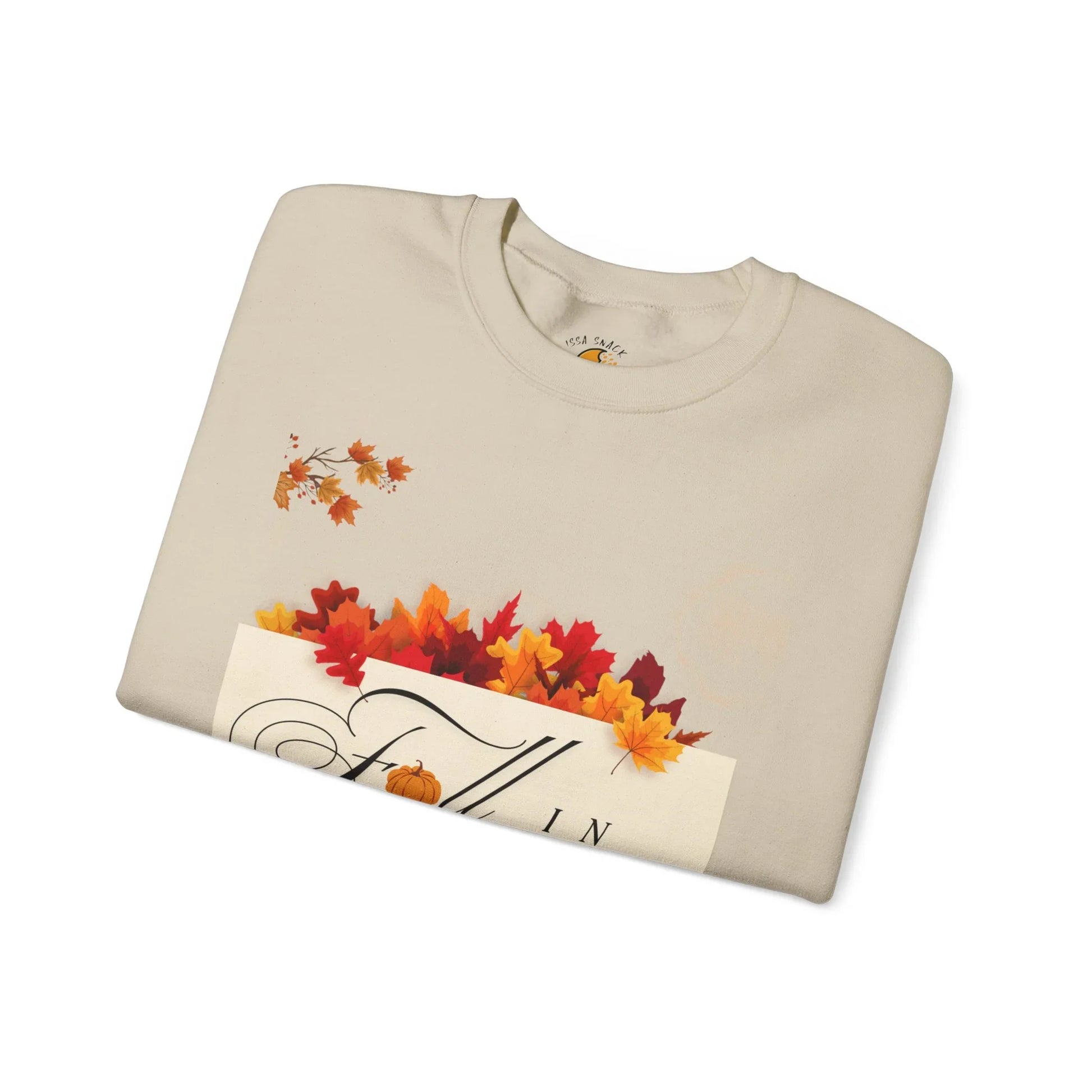 Beige sweatshirt with fall leaves, pumpkin graphic, and 'Fall in' text design