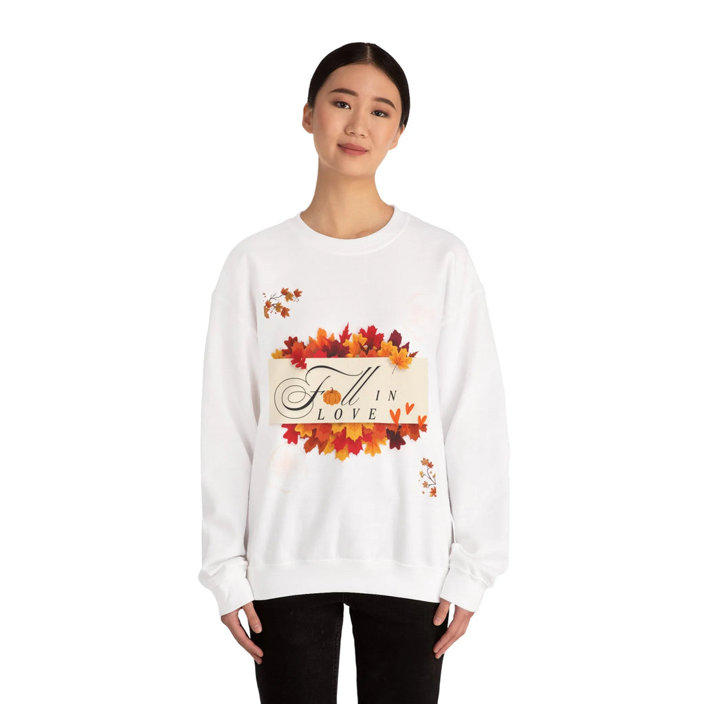 Woman wearing white sweatshirt with fall leaves and 'Fall in Love' text design